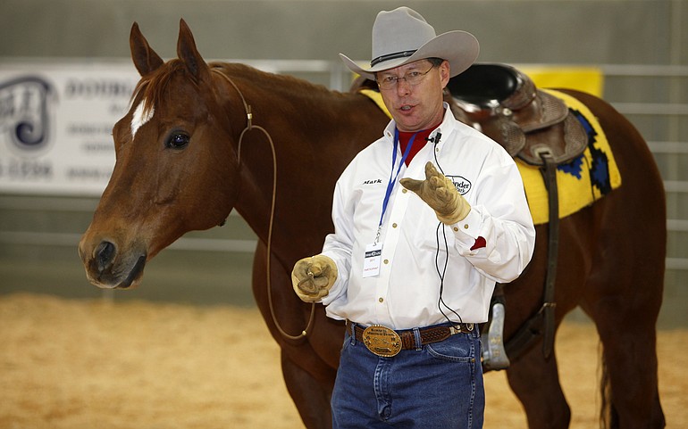 Mark Bolender does a demonstration with his quarter horse, Checkers, on Saturday during the Washington State Horse Expo at the Clark County Event Center at the Fairgrounds.