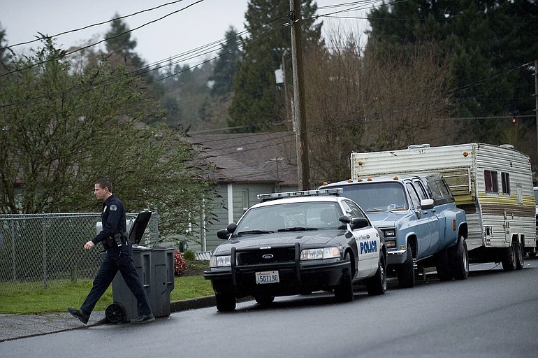 Vancouver Police Officer Ken Suvada follows up on an investigation on Martin Way in the Edgewood Park neighborhood.