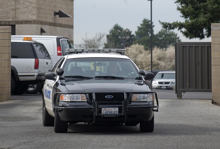 A police cruiser leaves the Vancouver Police East Precinct on Monday.