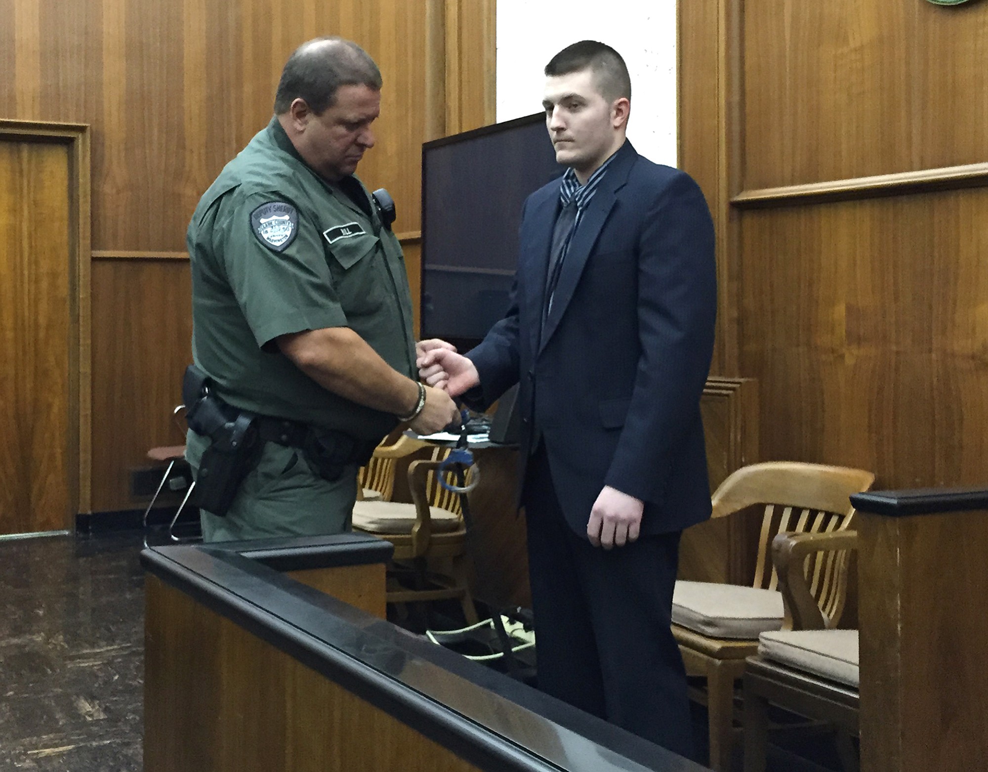 Jarrod Wiebe, 27, of Snohomish is escorted out of Clark County Superior Court Judge Scott Collier's courtroom after a jury found him guilty of 16 felony charges related to a home-invasion robbery in Ridgefield in December.