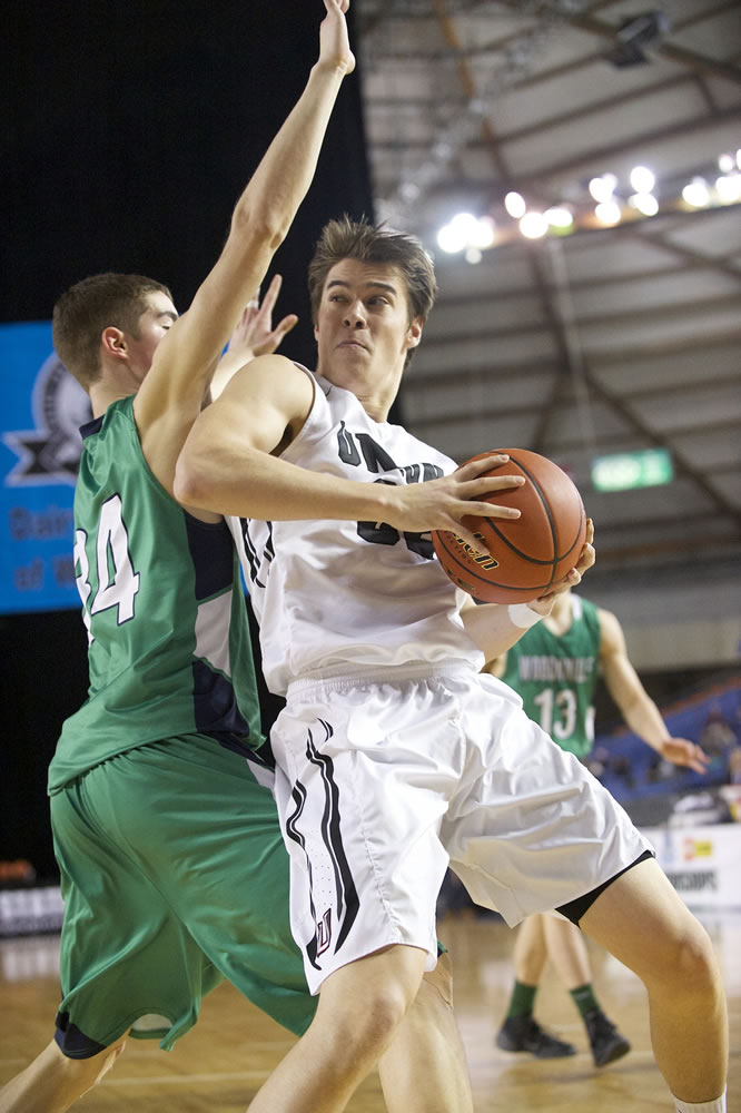 Riley Hawken makes a move to the basket as Union beats Woodinville 69-45 to win third place at the 2015 WIAA Hardwood Classic 4A Boys tournament at the Tacoma Dome, Saturday, March 7, 2015.