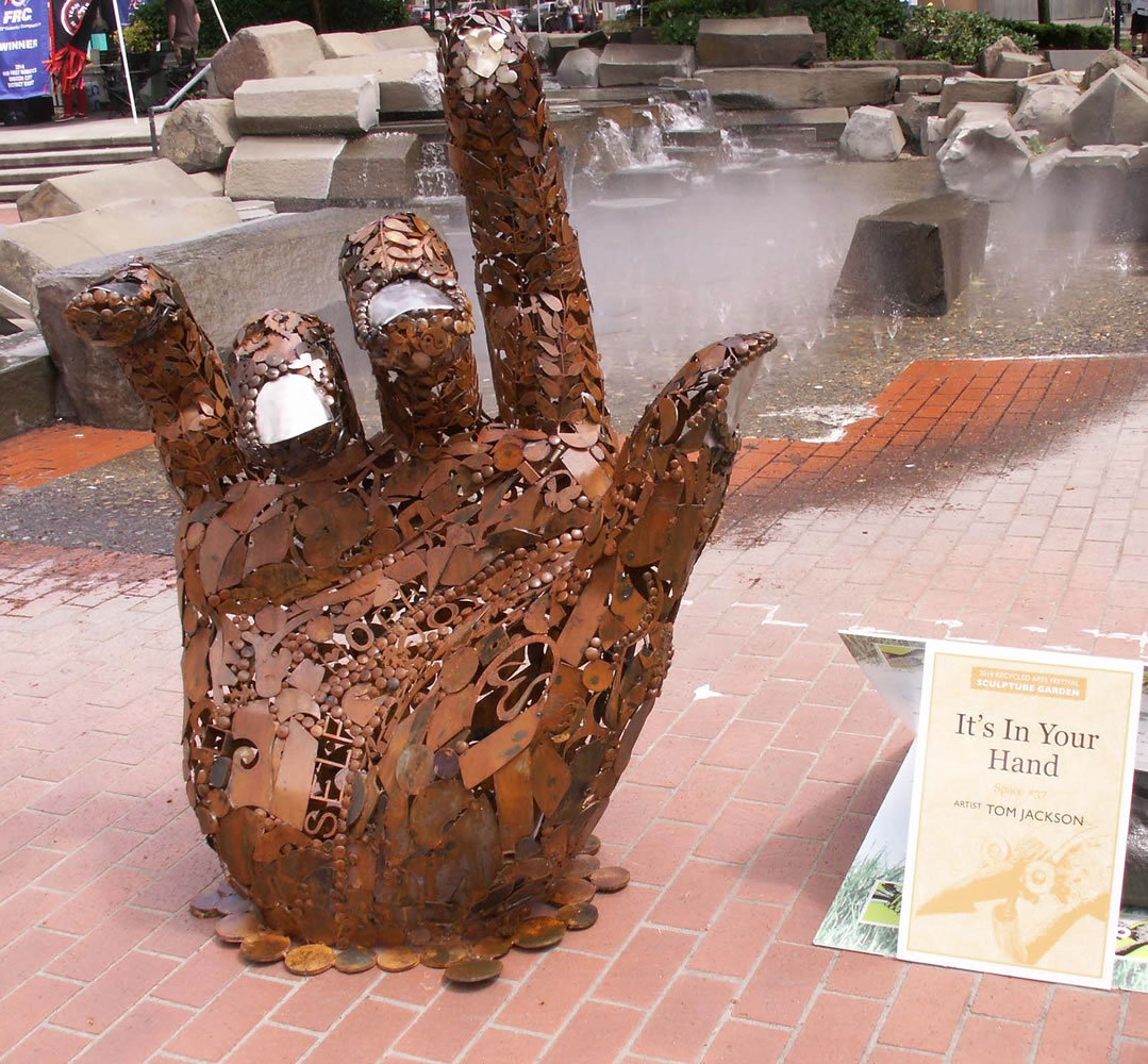 Esther Short: &quot;It's In Your Hand,&quot; by Tom Jackson, was voted top sculpture at the Recycled Arts Festival, held June 28-29 in Esther Short Park.