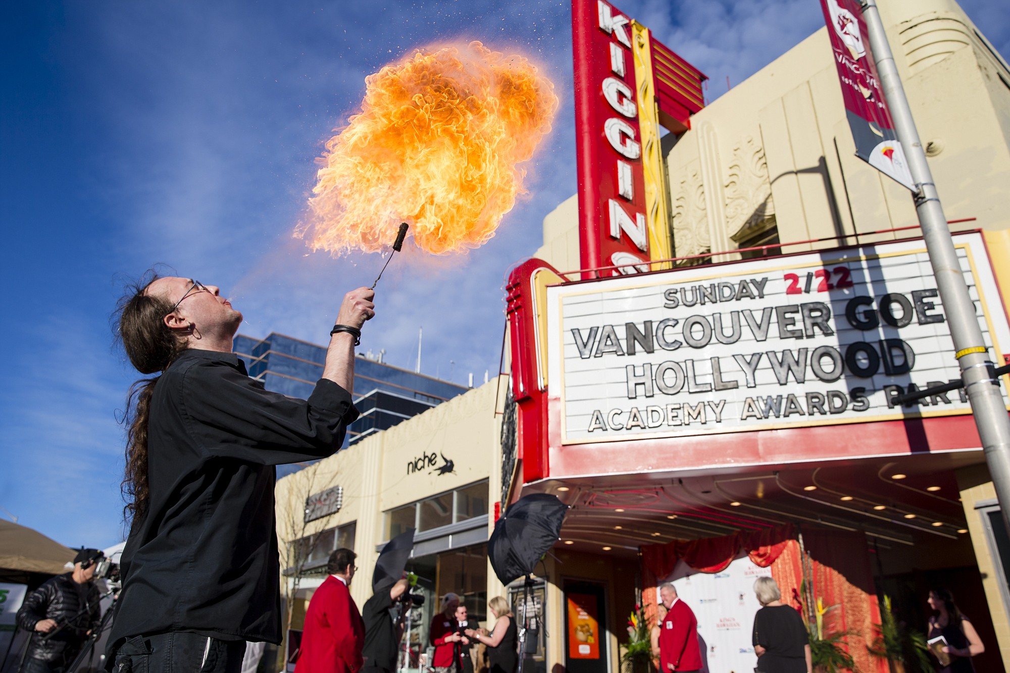 Fire breather Ian Roy performs Sunday as guests arrive at the Kiggins Theatre for Vancouver Goes Hollywood.