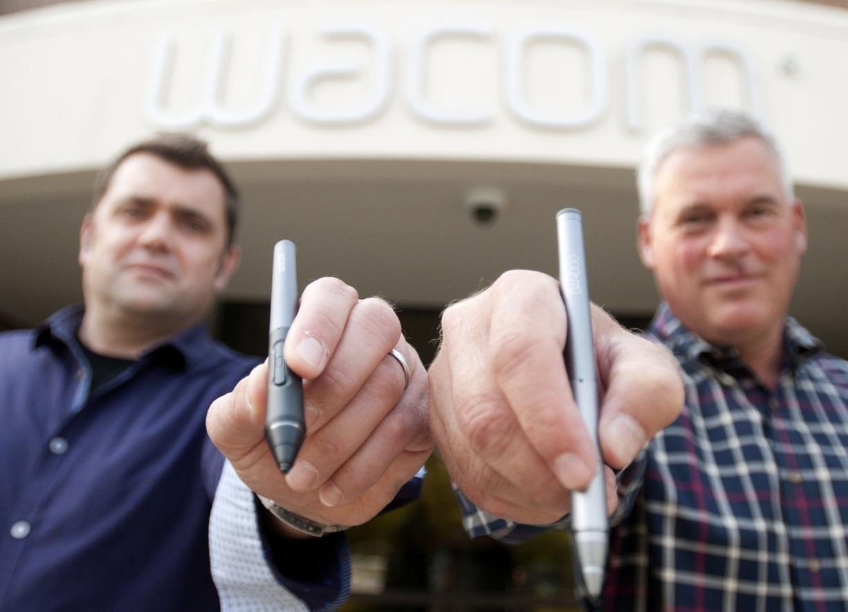 Wacom's Rick Peterson, left, and Doug Little, each hold a styli outside the company's Vancouver office.