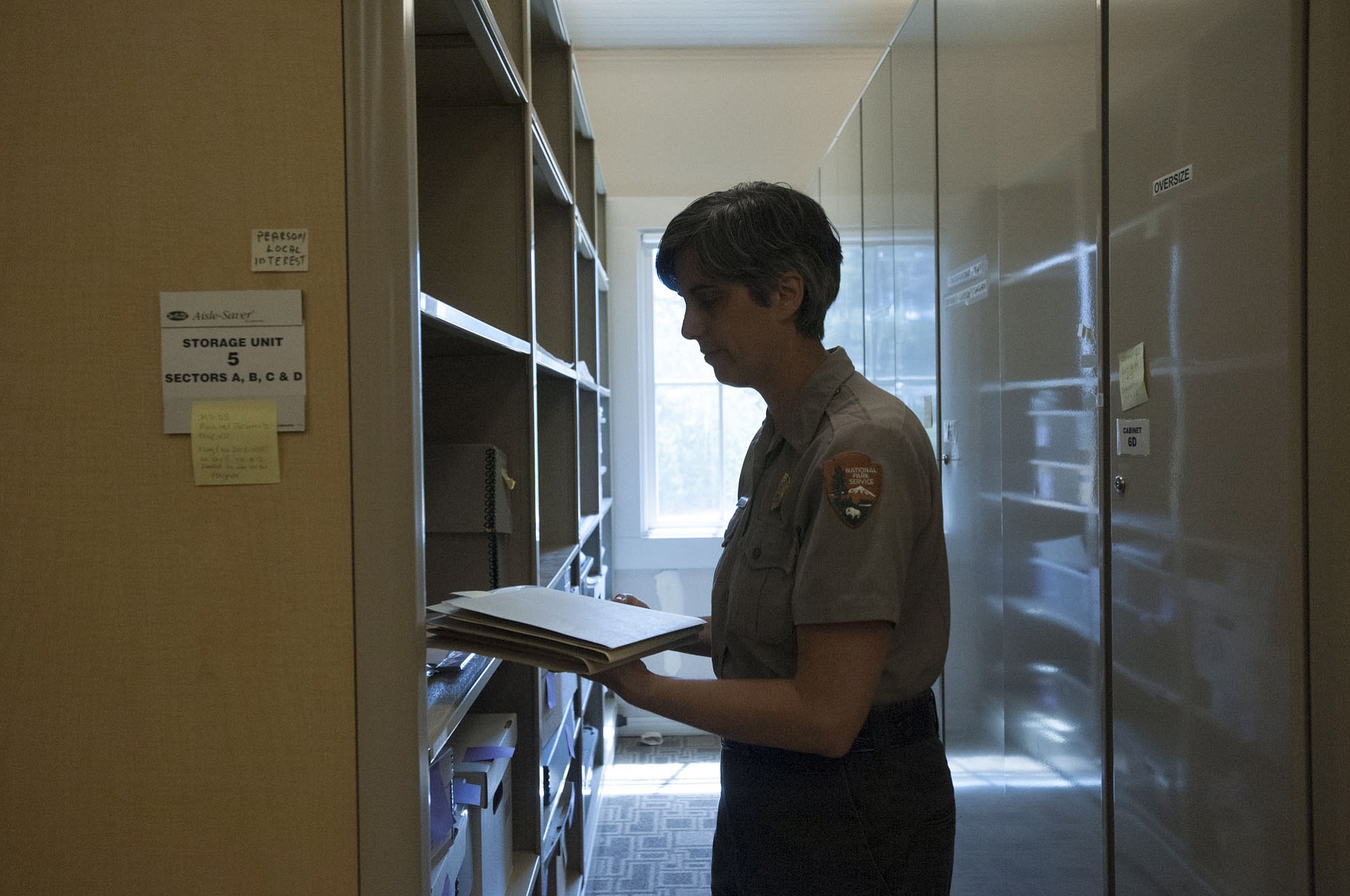 National Park Service curator Theresa Langford goes into a Fort Vancouver archive for documents that will be part of a Pearson Air Museum exhibit.