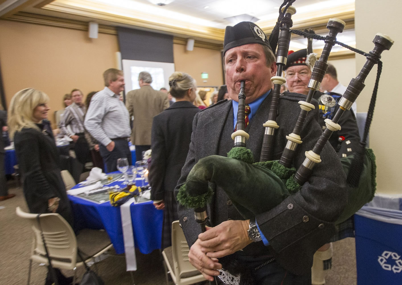 Timothy Gunn plays bagpipes to welcome in the haggis at the inaugural Robert Burns Dinner at Clark College.