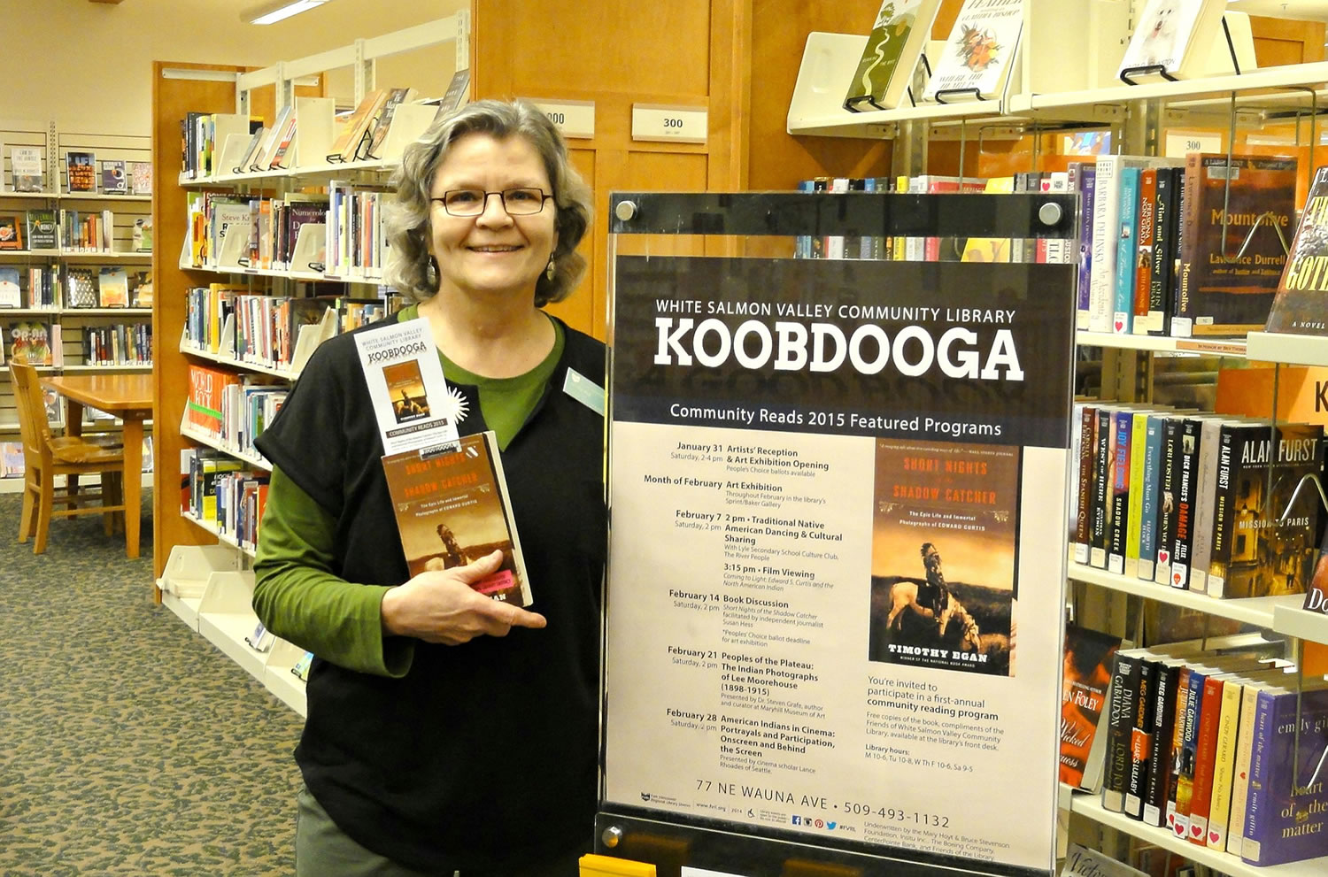 White Salmon Valley Community Library librarian Jennifer Hull holds &quot;Short Nights of the Shadow Catcher,&quot; chosen for the library's first Koobdooga: Community Reads program.