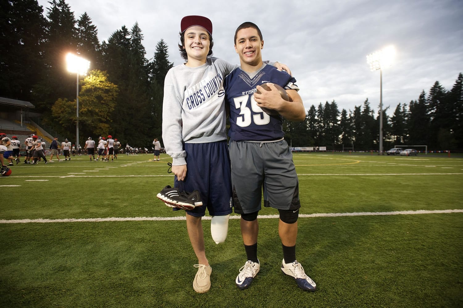 Jared Oman, left, shown, Wednesday, October 29, 2014, is a sophomore athlete from Skyview who recently had his left leg amputated.
