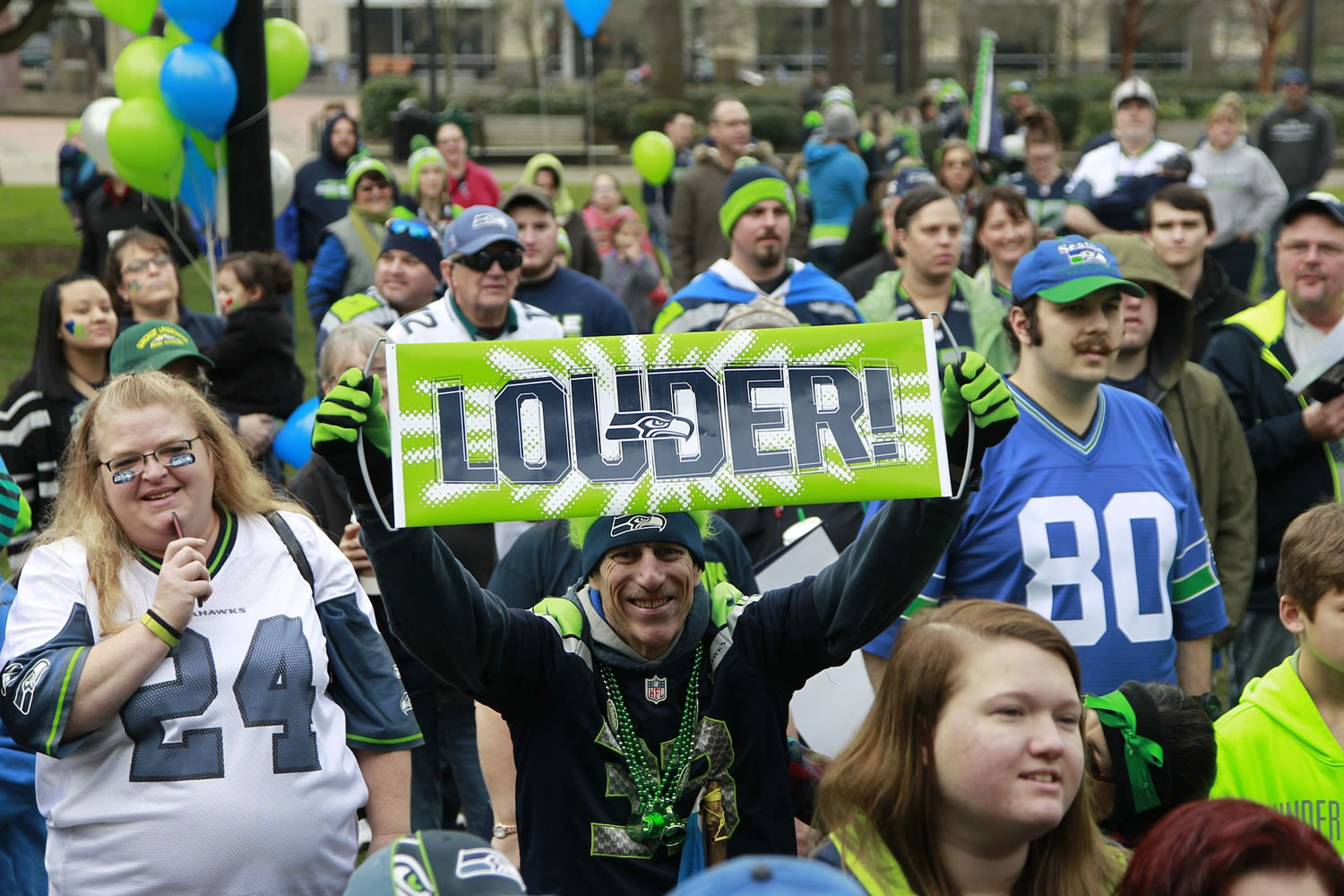 Fans of the Seattle Seahawks gather Saturday in Esther Short Park for a  12th man fan rally in advance of Sunday's Super Bowl.