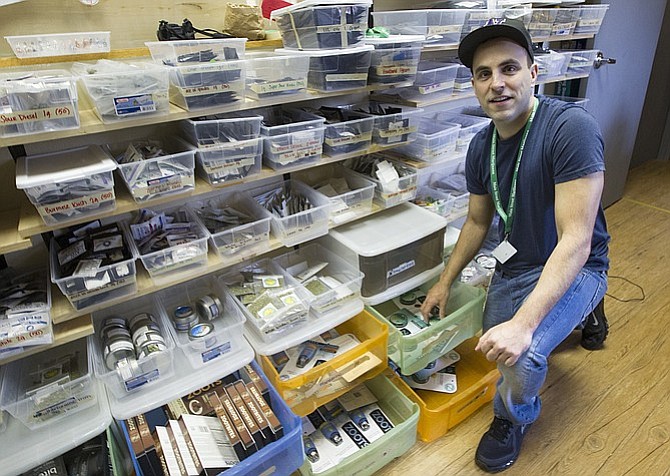 Ramsey Hamide of Main Street Marijuana looks over the large amount of stock available at the store a few weeks ago.