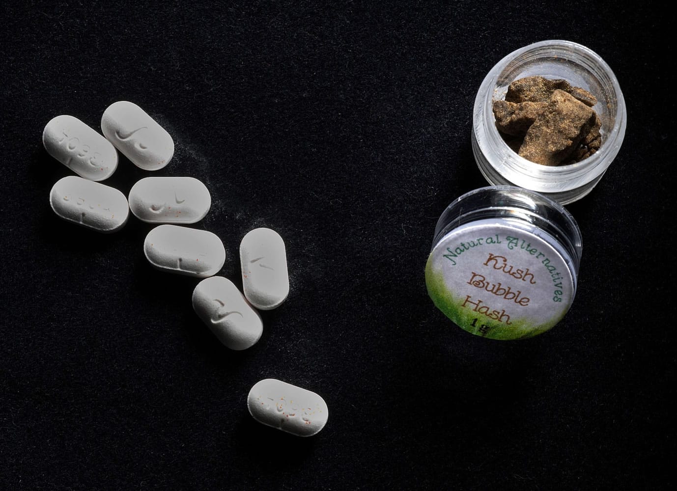 Hydrocodone, left, to treat chronic migraine headaches, and marijuana hash used to treat insomnia, both belonging to &quot;Christopher,&quot; who suffers from both.