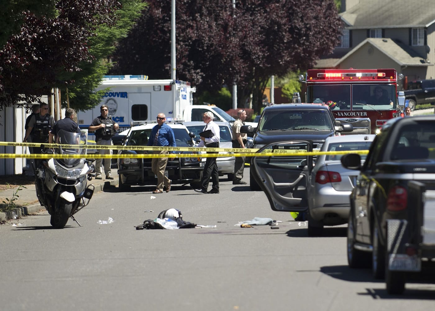 Detectives investigate a shooting of a Vancouver police officer Monday in east Vancouver.