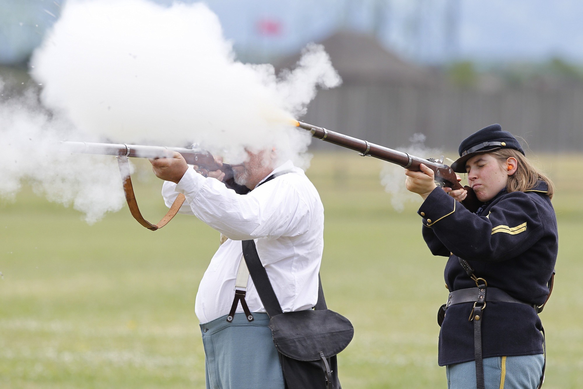 Volunteers prep for black powder shooting demonstrations at fort The
