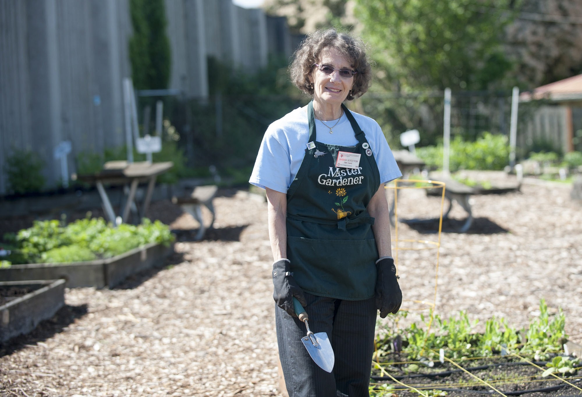 Master gardener Barbara Nordstrom teaches kids how to garden at the Hazel Dell School and Community Garden in Vancouver.