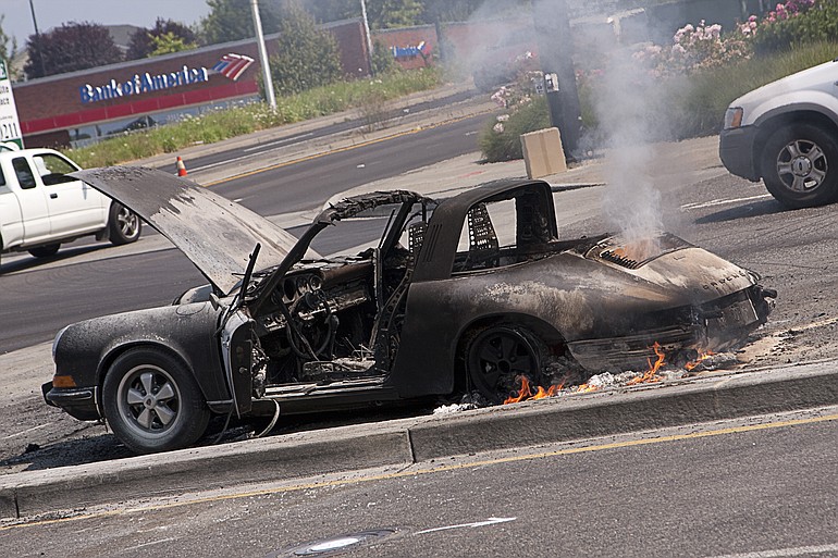 A 1973 Porsche burns Thursday at the intersection of Southeast 34th Street and 192nd Avenue in Vancouver.