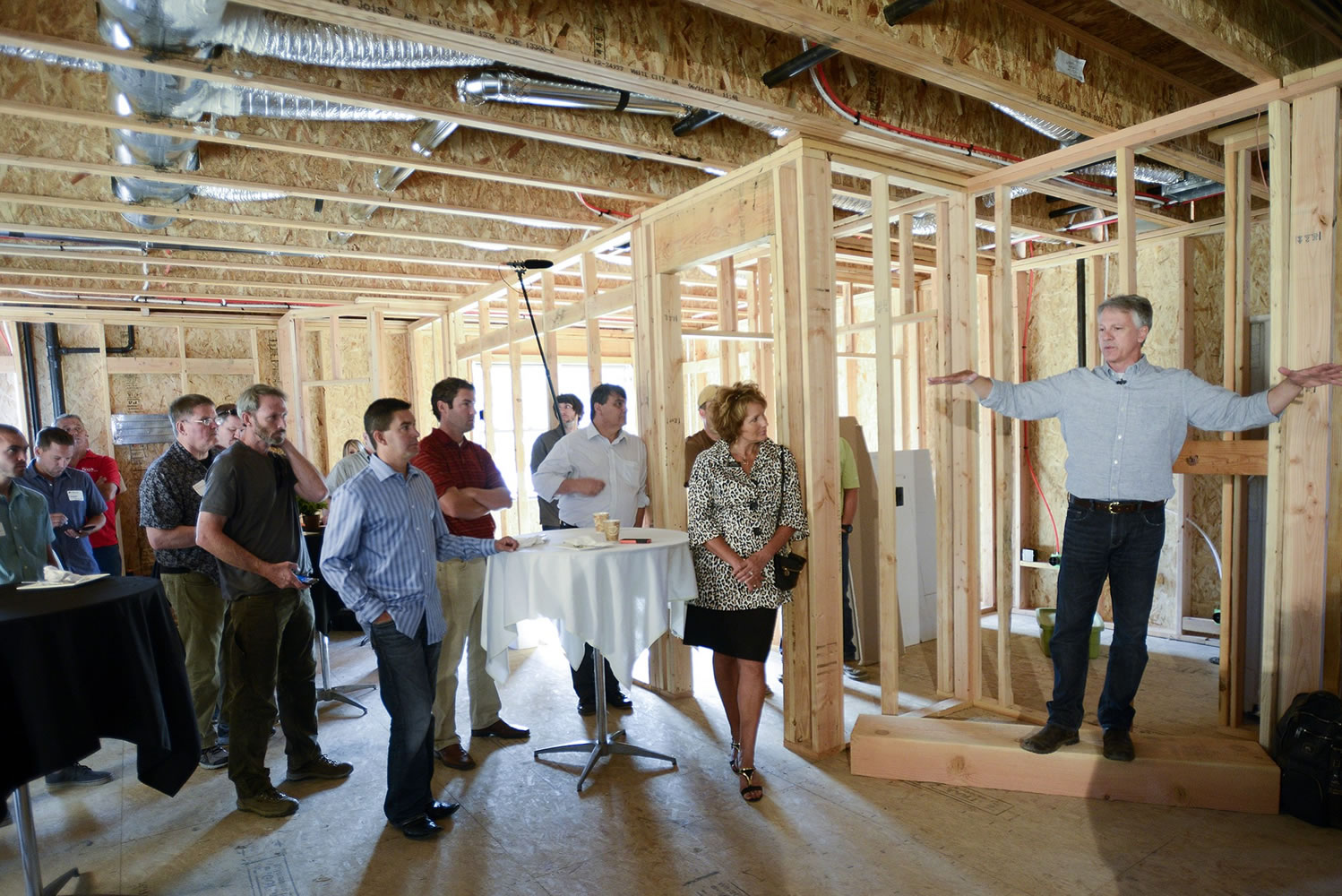 Ariane Kunze/The Columbian
Mark LaLiberte, right, a building science expert, led an informational tour on Thursday in a home under construction by Urban NW Homes in Ridgefield. He explained what builders are doing to make homes more sustainable, energy efficient and durable.