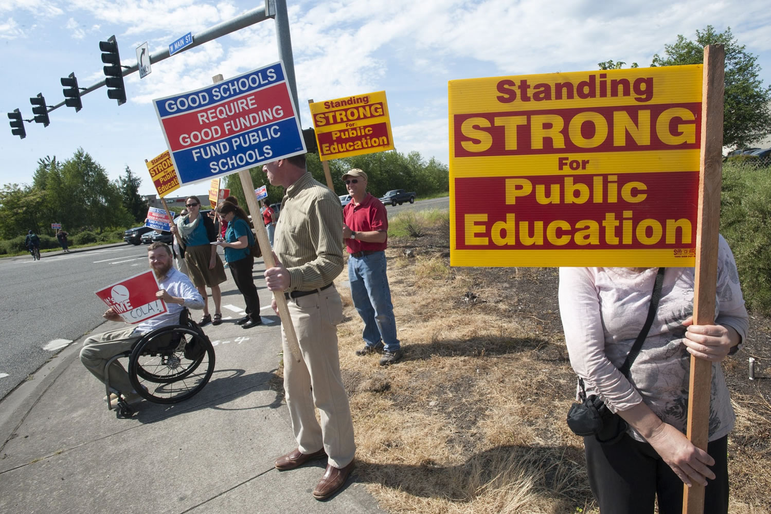 Teachers from Battle Ground picket at the busy intersection of Main Street and state Highway 503 after school Wednesday.
