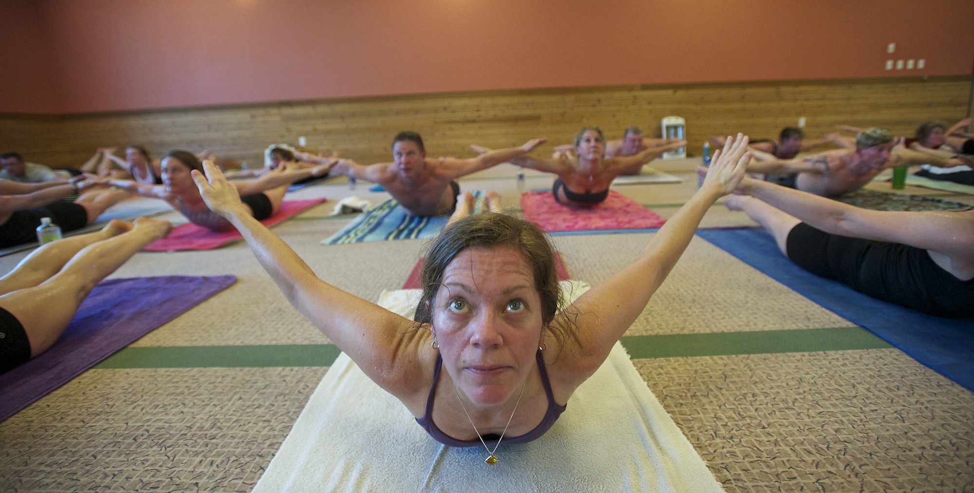 Danelle Berardinelli and other students look ready to fly during a class at Bikram Hot Yoga Vancouver.