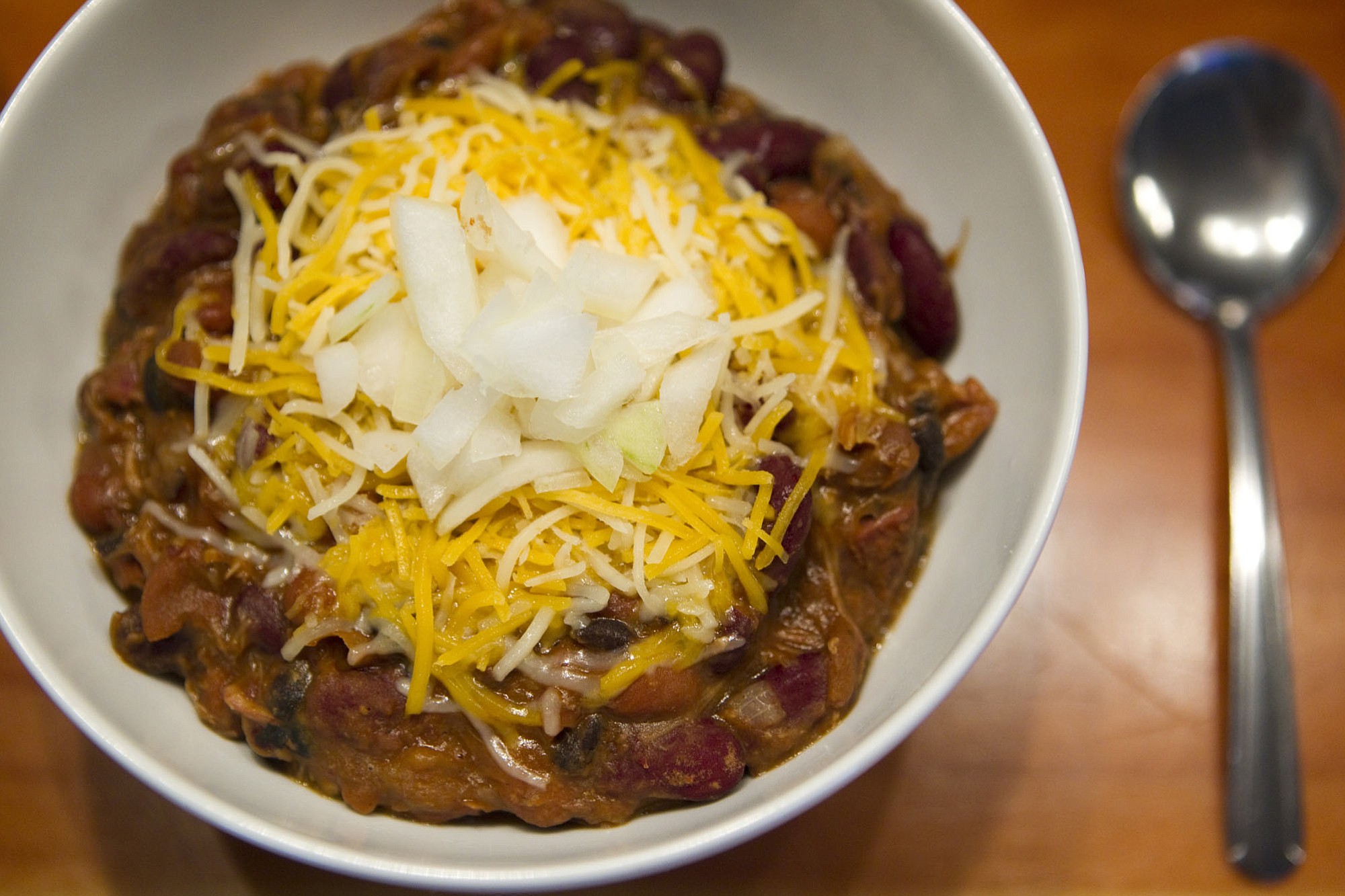 A bowl of red chili with beans, beef, cheese and onions is served at The Hoosegow, a new restaurant just south of the courthouse.