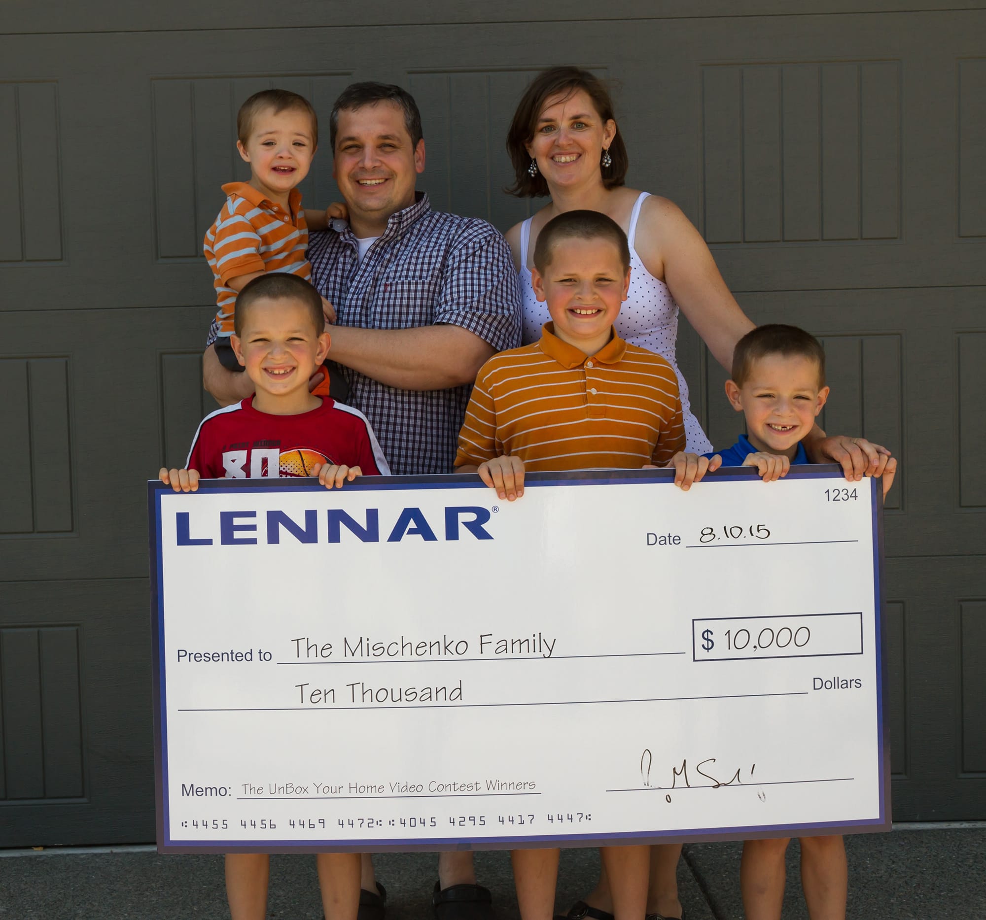 Orchards: The Mischenko family won $10,000 as part of the Unbox Your Home video contest after filming their first moments in their new home, built by developer Lennar Corp. Back row, from left: Seth, Craig and Grace Mischenko. Front row, from left: Timothy, Micah and Joseph Mischenko.