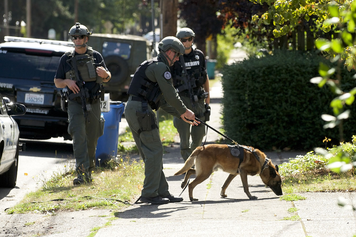 Police search for a homicide suspect near the intersection of Fourth Plain and Kauffman, Thursday, September 25, 2014.