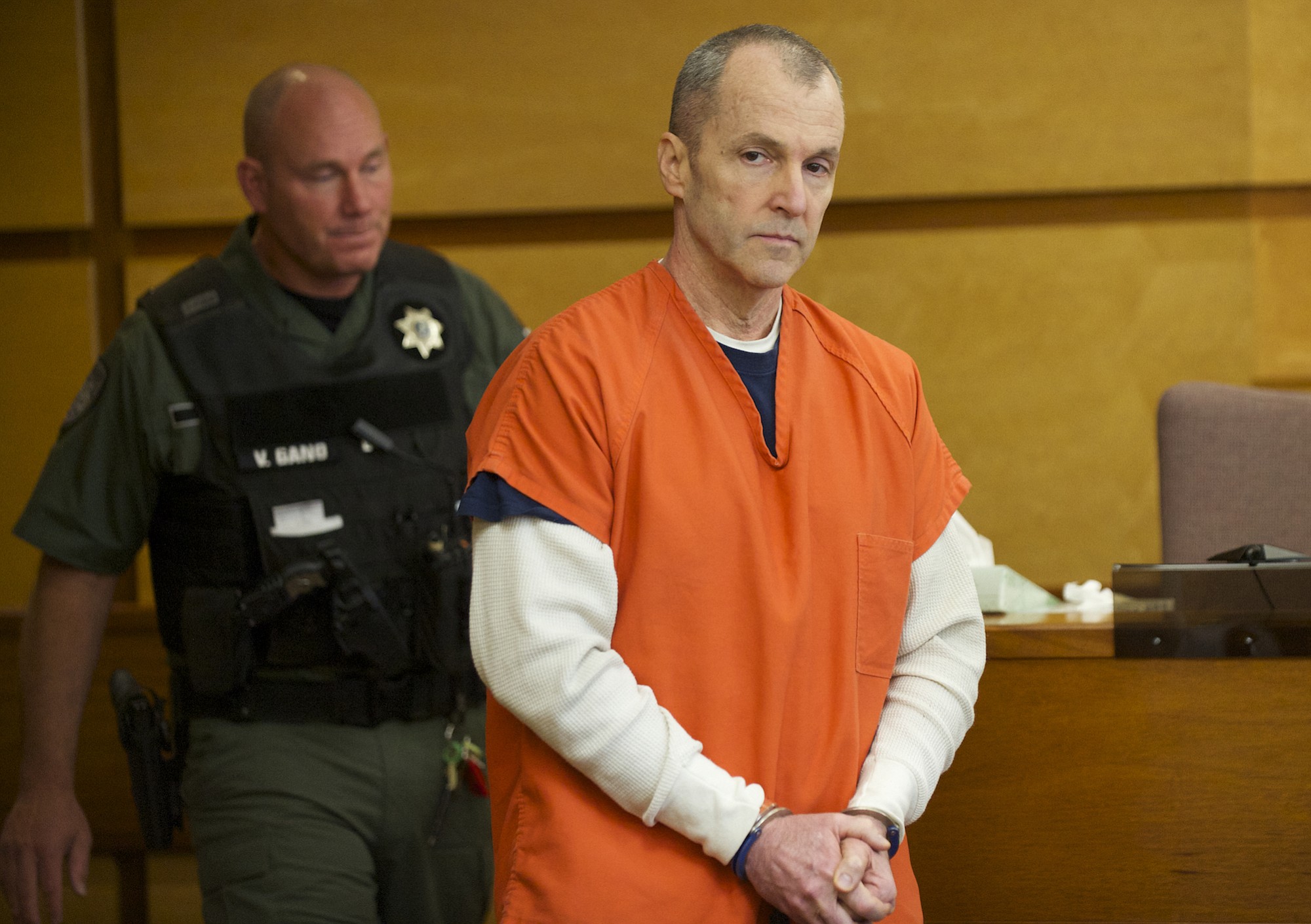 Kenneth Garrison, an ex-Lieutenant with Washington State Patrol who pleaded guilty to sexual abuse of two relatives, was sentenced to a minimum of just under 11 years in prison Friday.