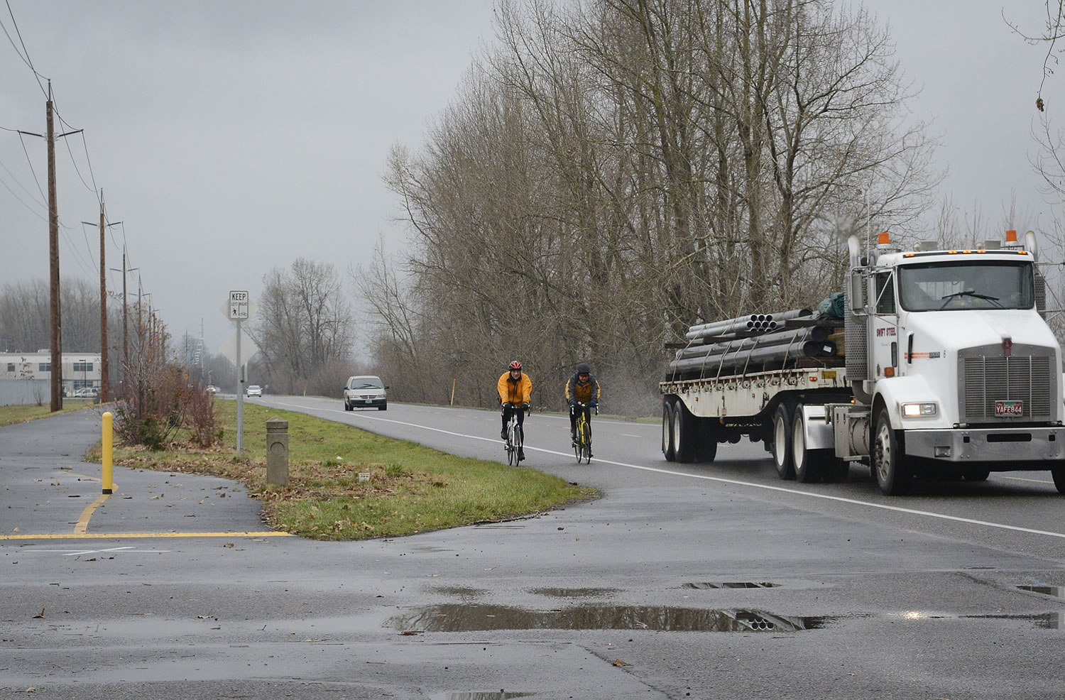 Bicyclists now use a shoulder along Northwest River Road, but a new dedicated bike trail from Fourth Plain to the Port of Vancouver headquarters will give them an alternative.