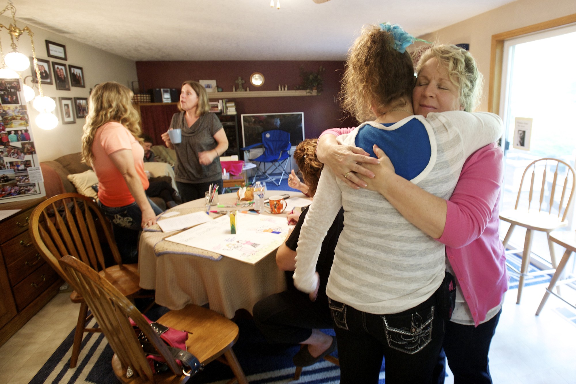Roberta Bernhardt gives her 29-year-old daughter, Melissa, a hug.