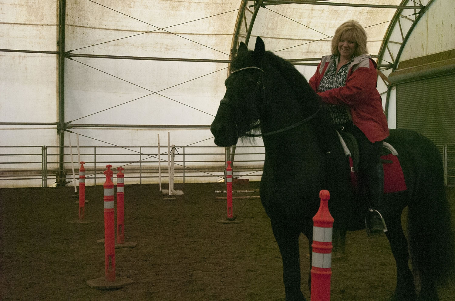 Susan McIntosh practices for the working equitation competition at Rob Zimmerman's South Ridge Farms ranch in Ridgefield.