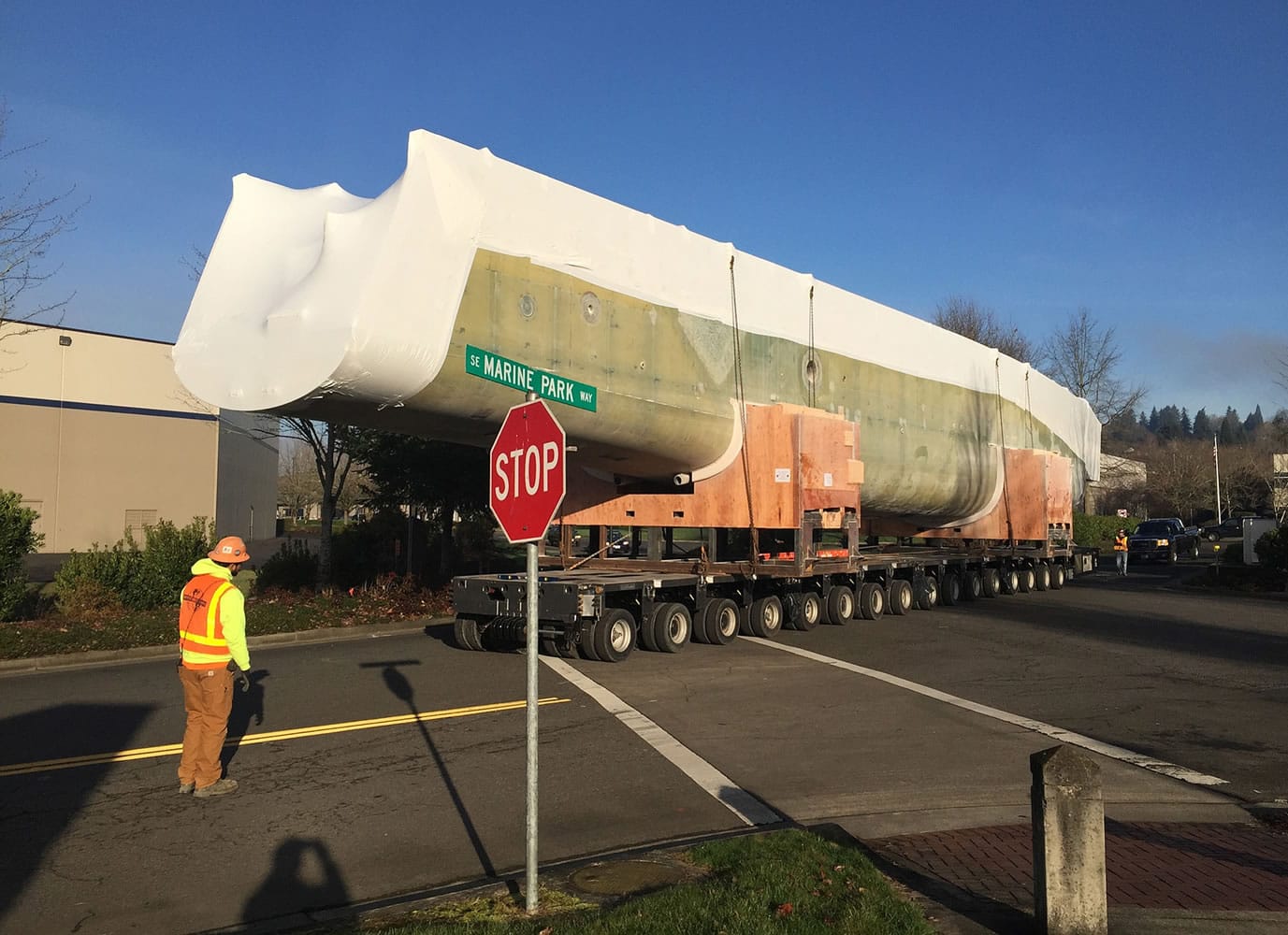 Moving crews removed this boat hull out of the Christensen Shipyards at 4400 S.E. Columbia Way on Feb. 12, three days after the company halted production at the manufacturing site. The hull was transported to the Columbia River and loaded onto a barge.