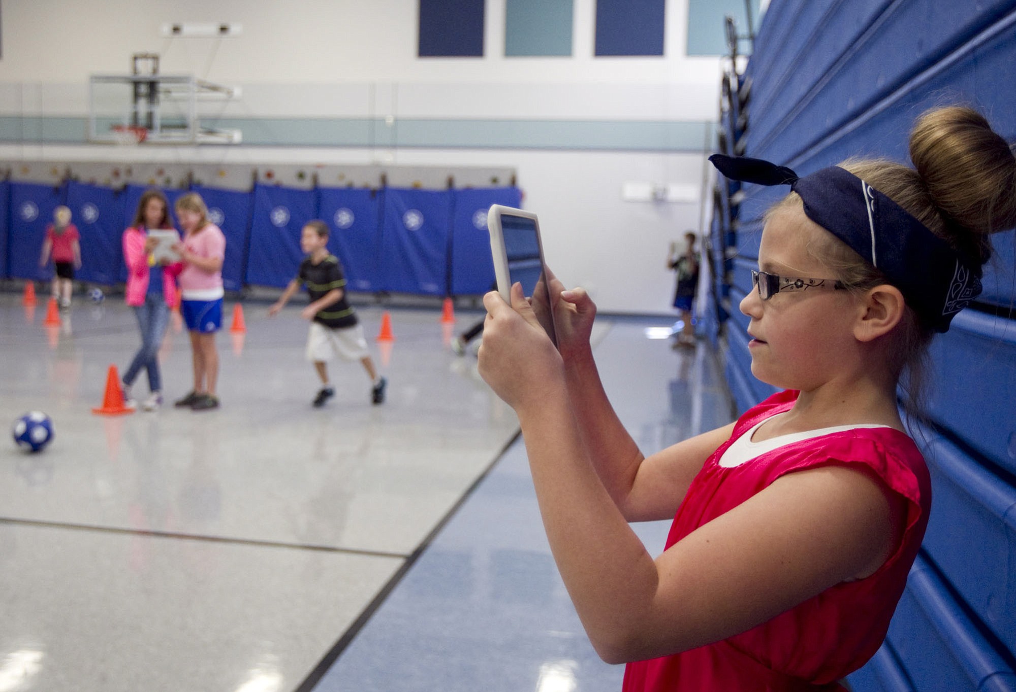 Ten-year-old Olivia Kessinger uses an iPad in a PE class on Oct. 7 at Gause Elementary in Washougal.