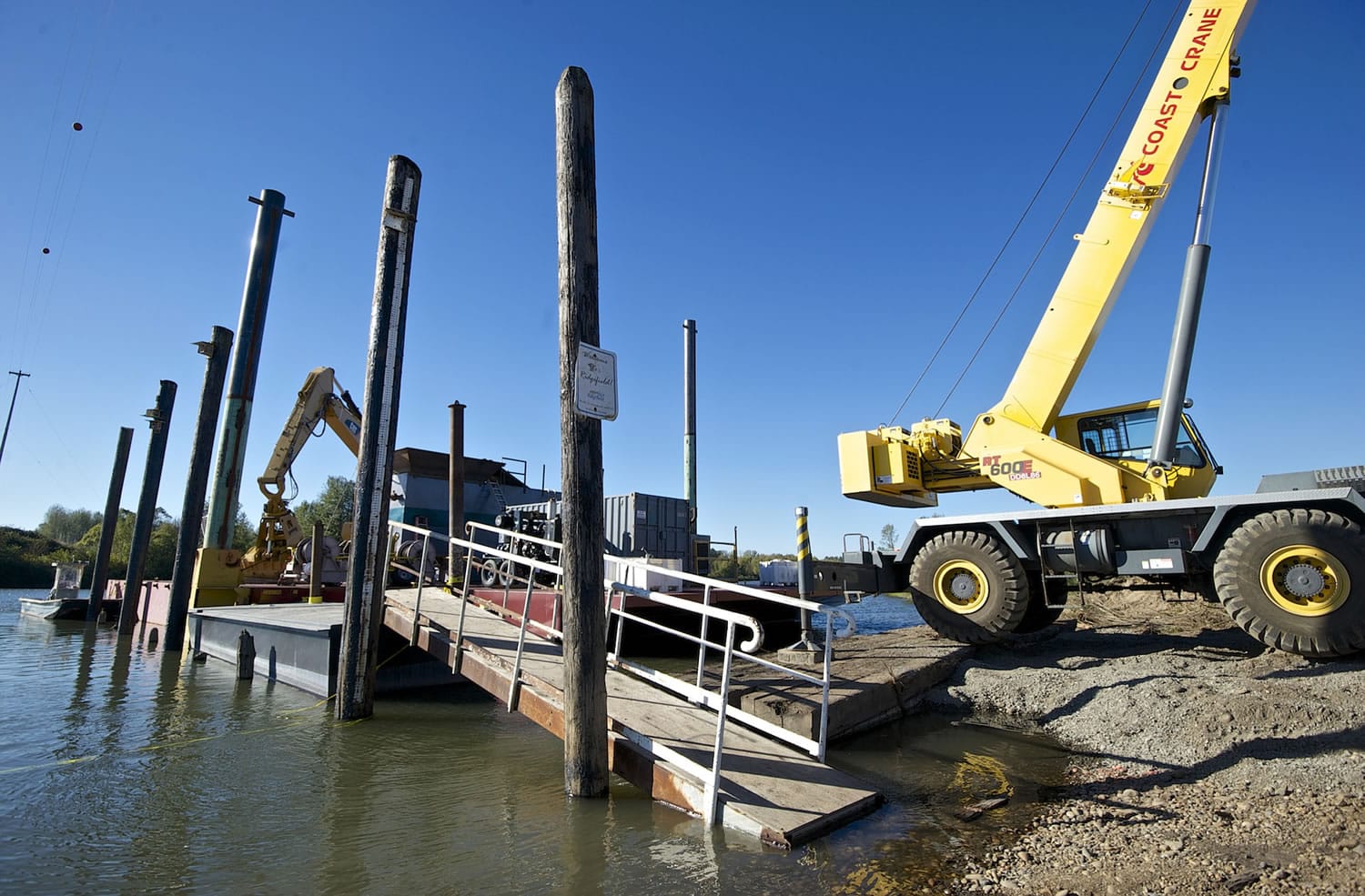 Dredging equipment sits ready to go Monday next to Lake River.