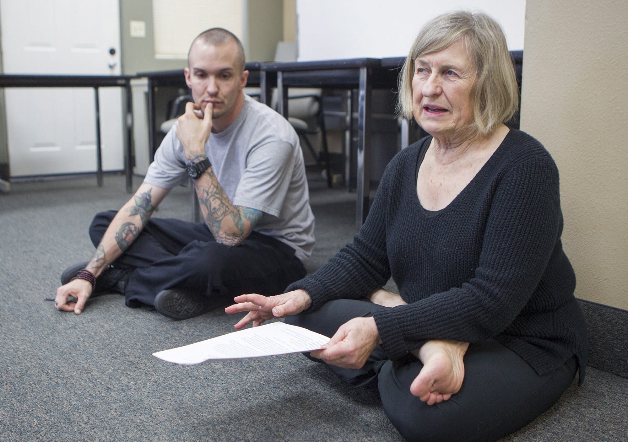 David Hill listens as Peggy McCarthy leads a yoga class at the Vancouver office of the National Alliance on Mental Illness.