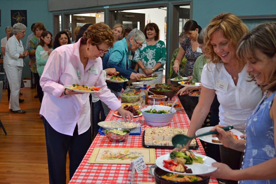 Vancouver's Dining for Women charitable group meets in 2012 to share food and raise money for the Children of Vietnam organization.