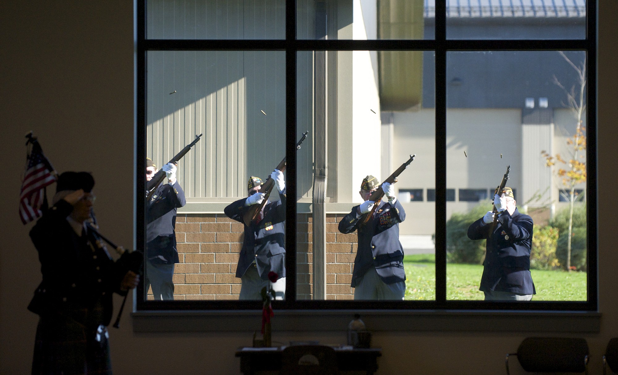 VFW members fire a rifle salute Tuesday rifle during the Veterans Day Celebration at the Armed Forces Reserve Center in east Vancouver.