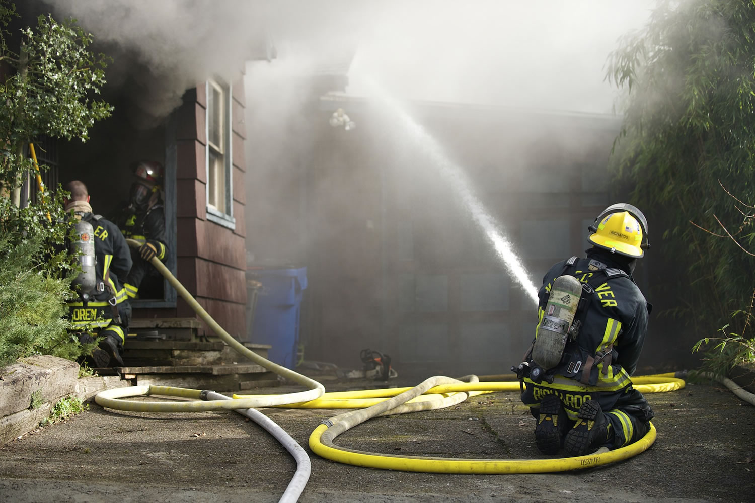 Firefighters battle a blaze Wednesday at 3111 U St.