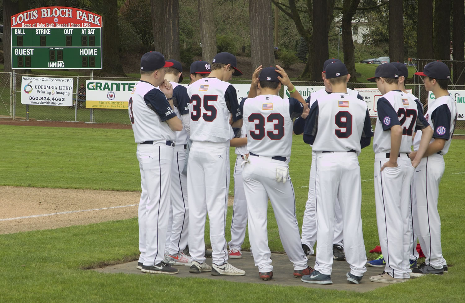 Players assemble before the home run derby starts at Louis Bloch Park in Camas on Saturday.