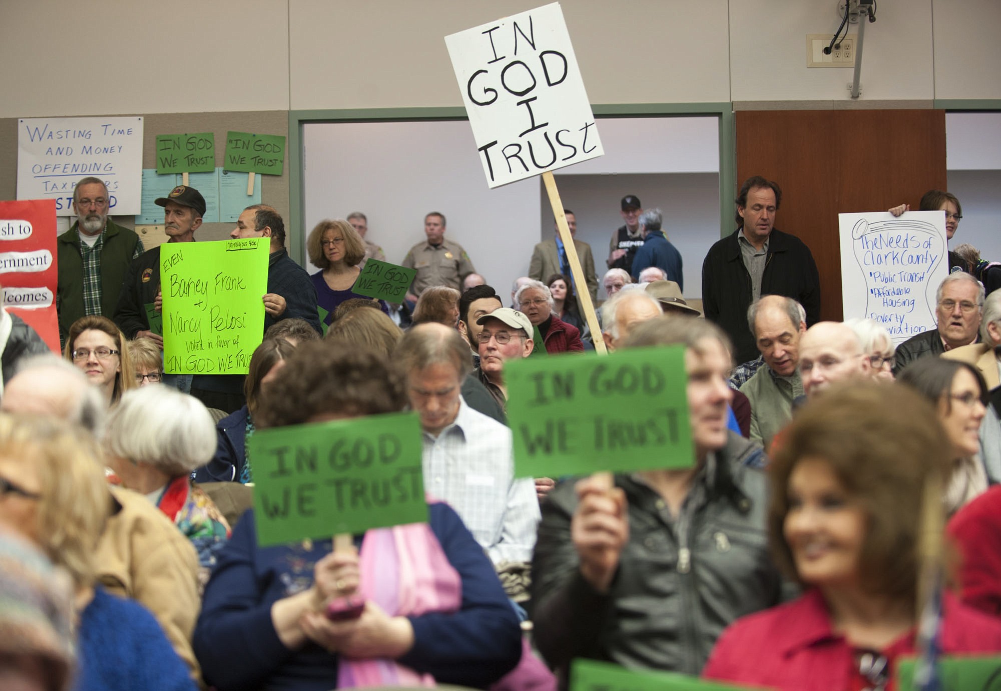 Clark county residents gather in a public hearing room to talk about whether the words  &quot;In God We Trust&quot; should be used in a county public hearing room in Vancouver.
