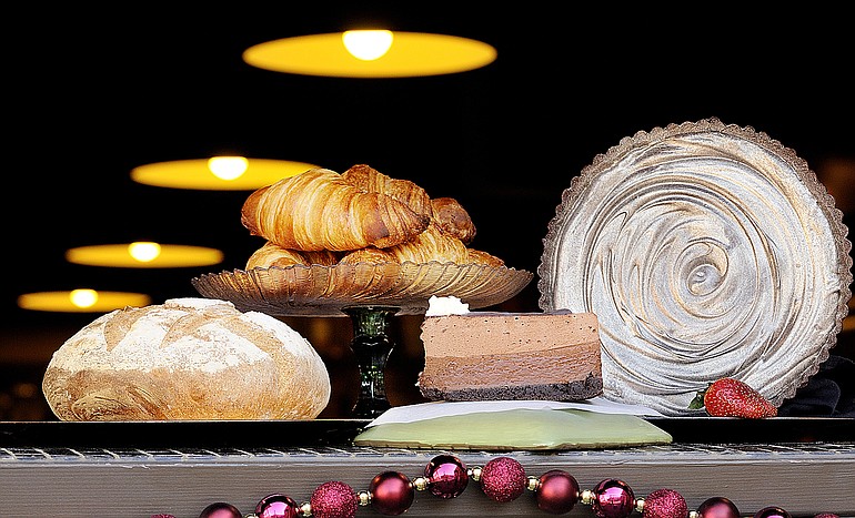 Je T'Aime Bakery's selection includes, from left, Rustic Garlic Loaf, Butter Croissants, Chocolate Marble Mousse Layer Cake and Bittersweet Chocolate Gorgonzola Dolce Torte.