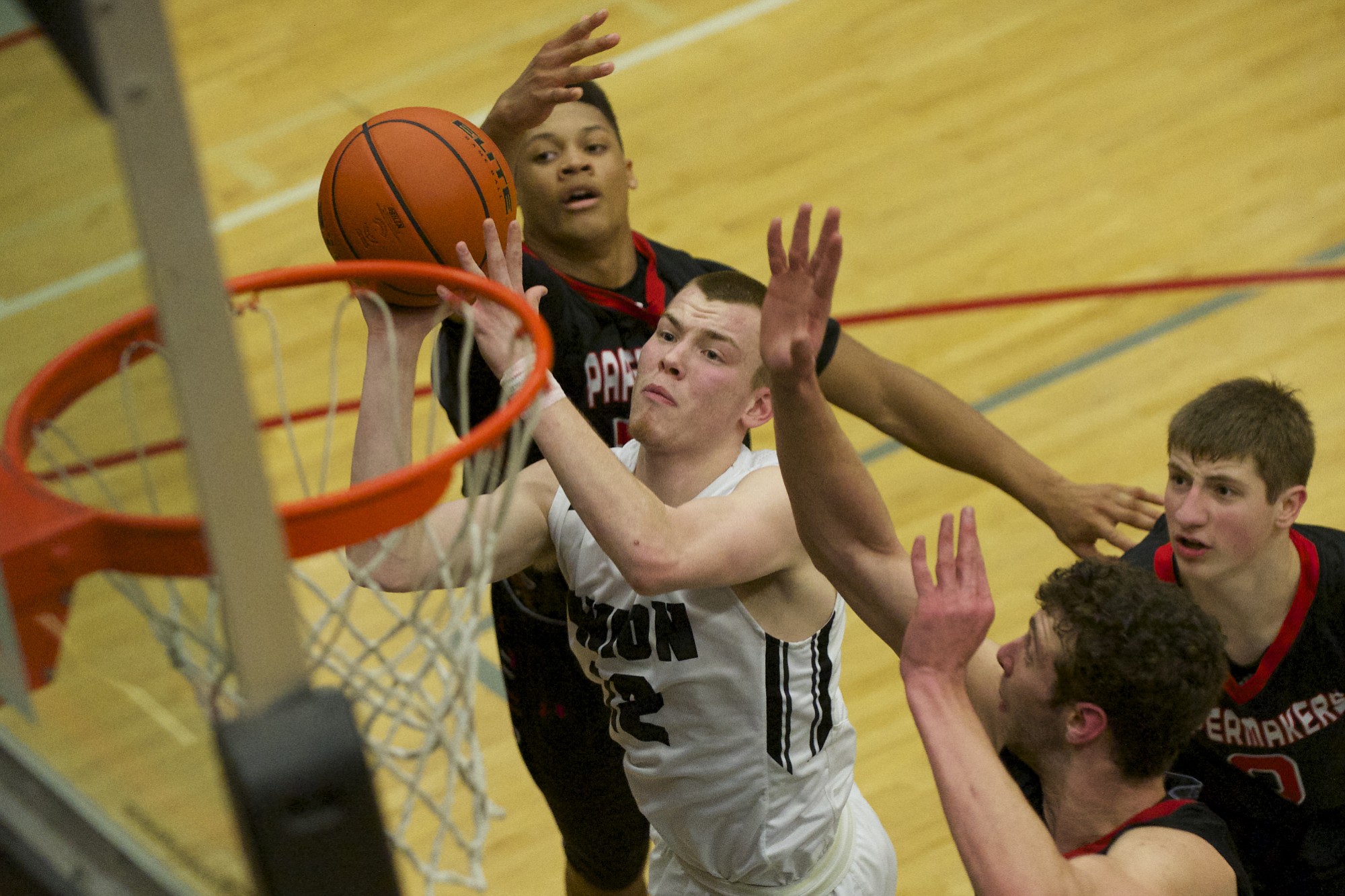 Union's Micah Paulson drives to the basket against Camas.