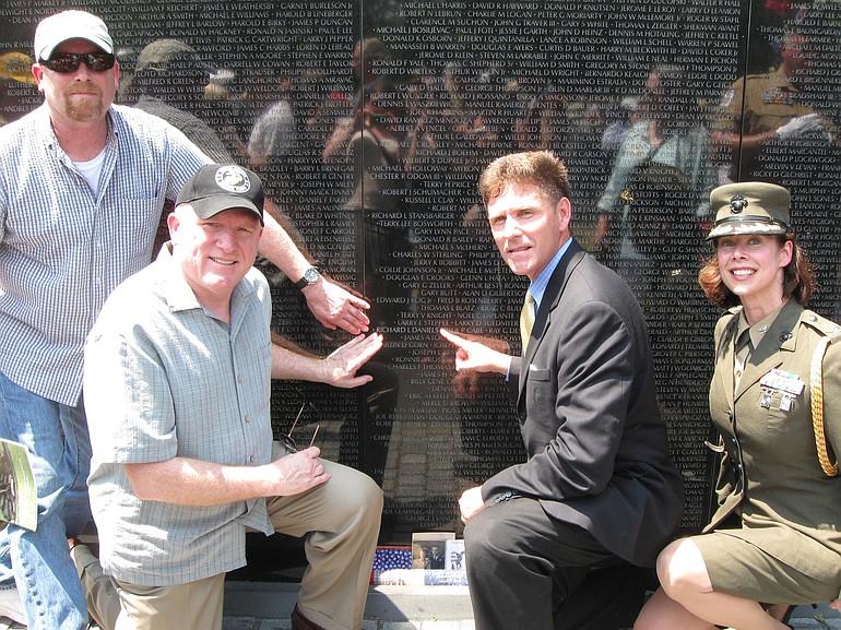 Washougal: From left, brothers Mike and Roger Daniels were joined by Assistant Secretary of the Navy Juan M. Garcia and his special assistant, Col. Emily Swain, at a commemoration adding five names to the Vietnam Veterans Memorial in Washington, D.C.