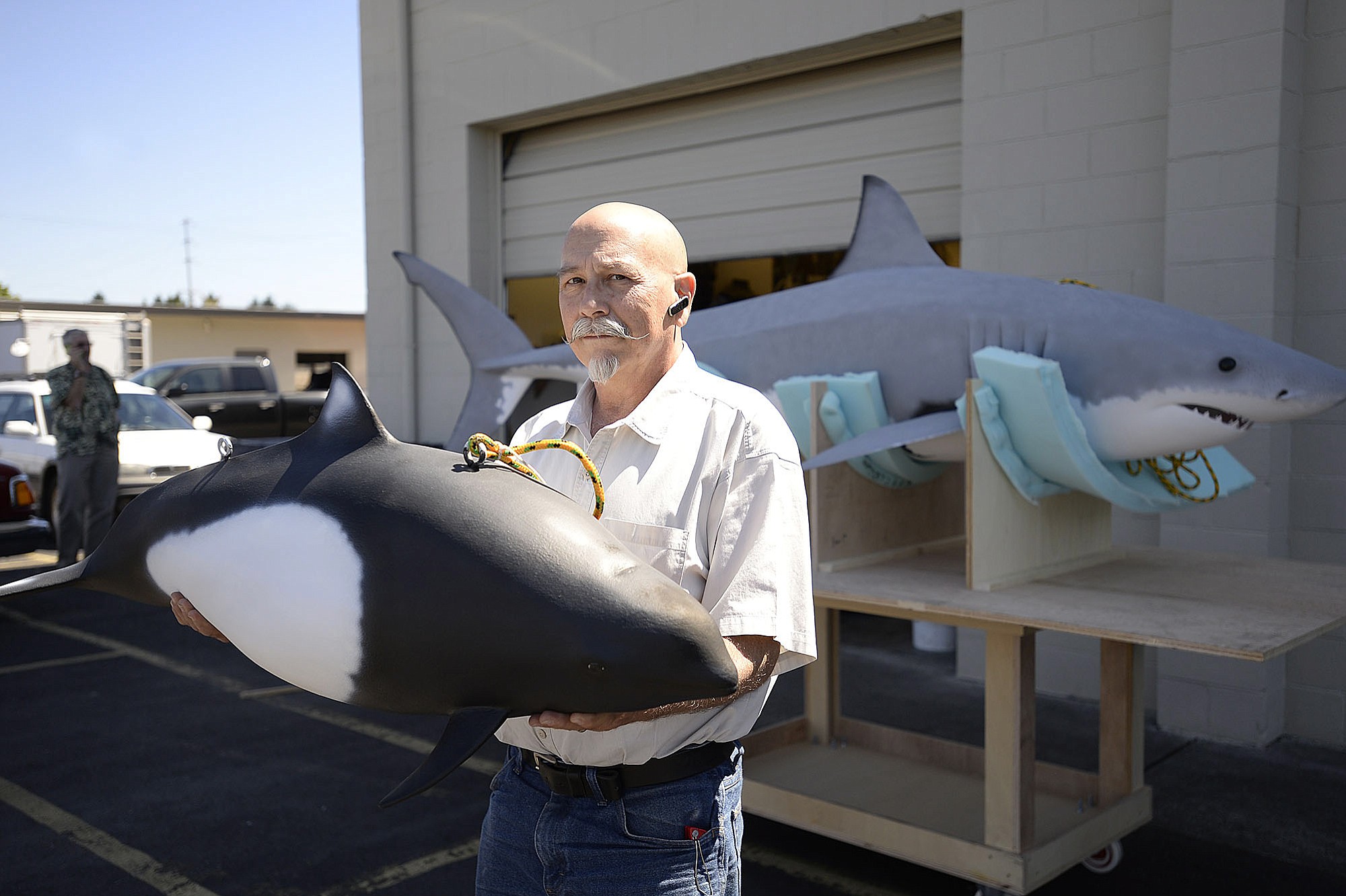 Jim Engelhardt of Show Time Exhibitions with a model of a Dall's porpoise that is part of a display for Point Reyes National Seashore in California.