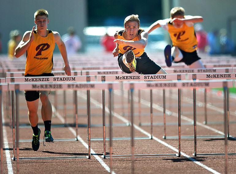 Prairie's Peter Zalk, middle, James Phillips, left, and Josiah Schmidt, far right, finished 1-2-4 in the 110-meter hurdles at the 3A district meet Thursday.