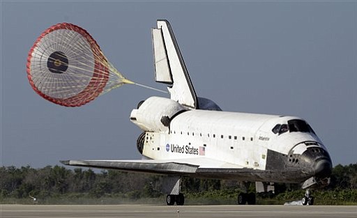 The space shuttle Atlantis deploys her braking parachute during landing on Kennedy Space Center's runway 33 Wednesday, May 26, 2010, in Cape Canaveral, Fla.