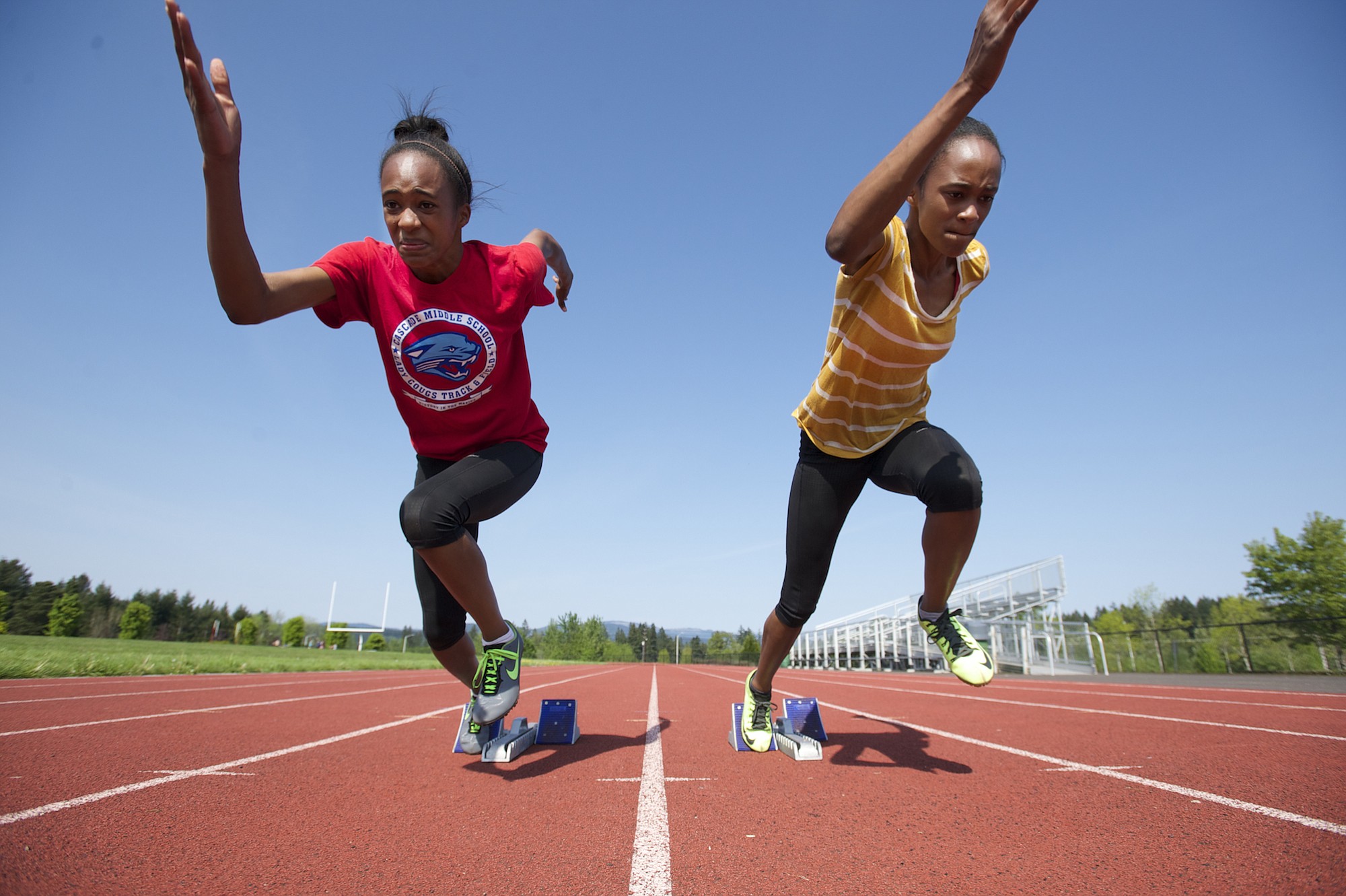 Union High School's identical twin sisters Dai'lyn, left, and Jai'lyn Merriweather shown, Thursday, April 30, 2015, are two of the top sprinters in the state.