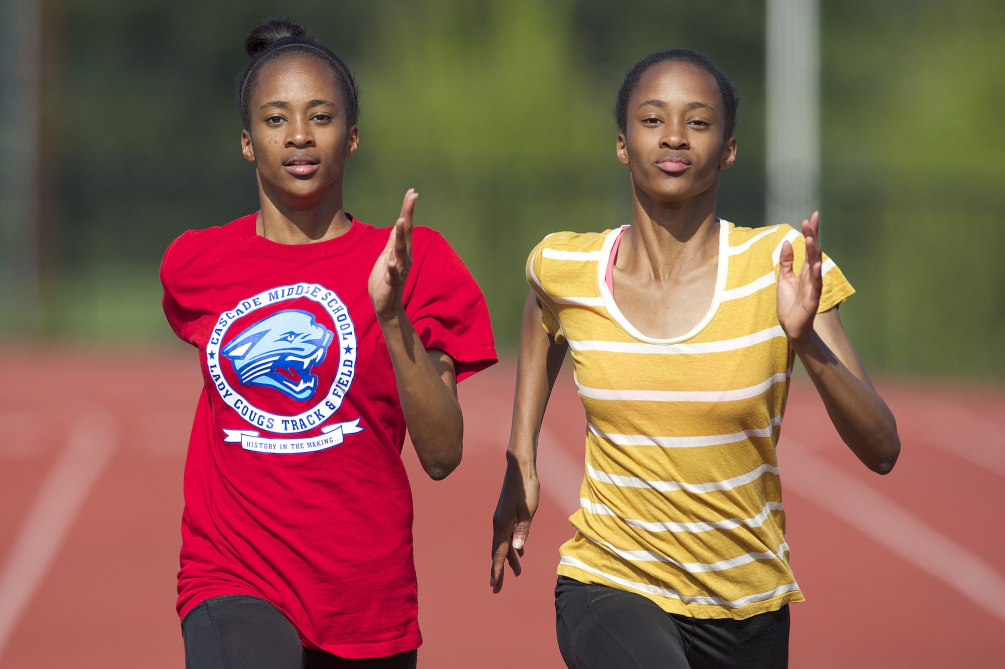 Union High School's identical twin sisters Dai'lyn, left, and Jai'lyn Merriweather shown, Thursday, April 30, 2015, are two of the top sprinters in the state.