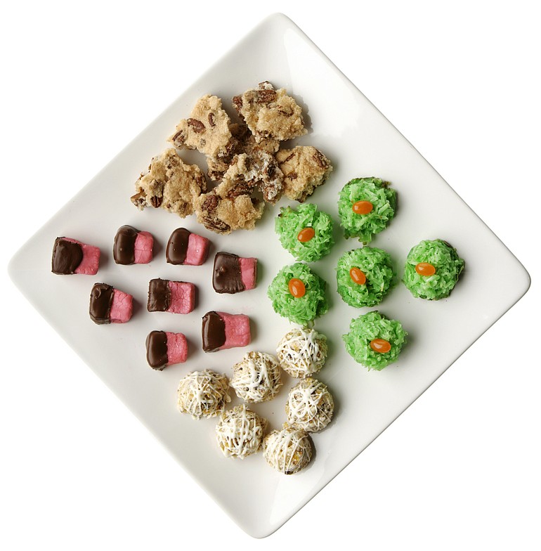 An assortment of candies, clockwise from top, Oven Nut Brittle, Easy Macaroon Nests, Fruit and Nut Balls, and No-Cook Fondant Creams.