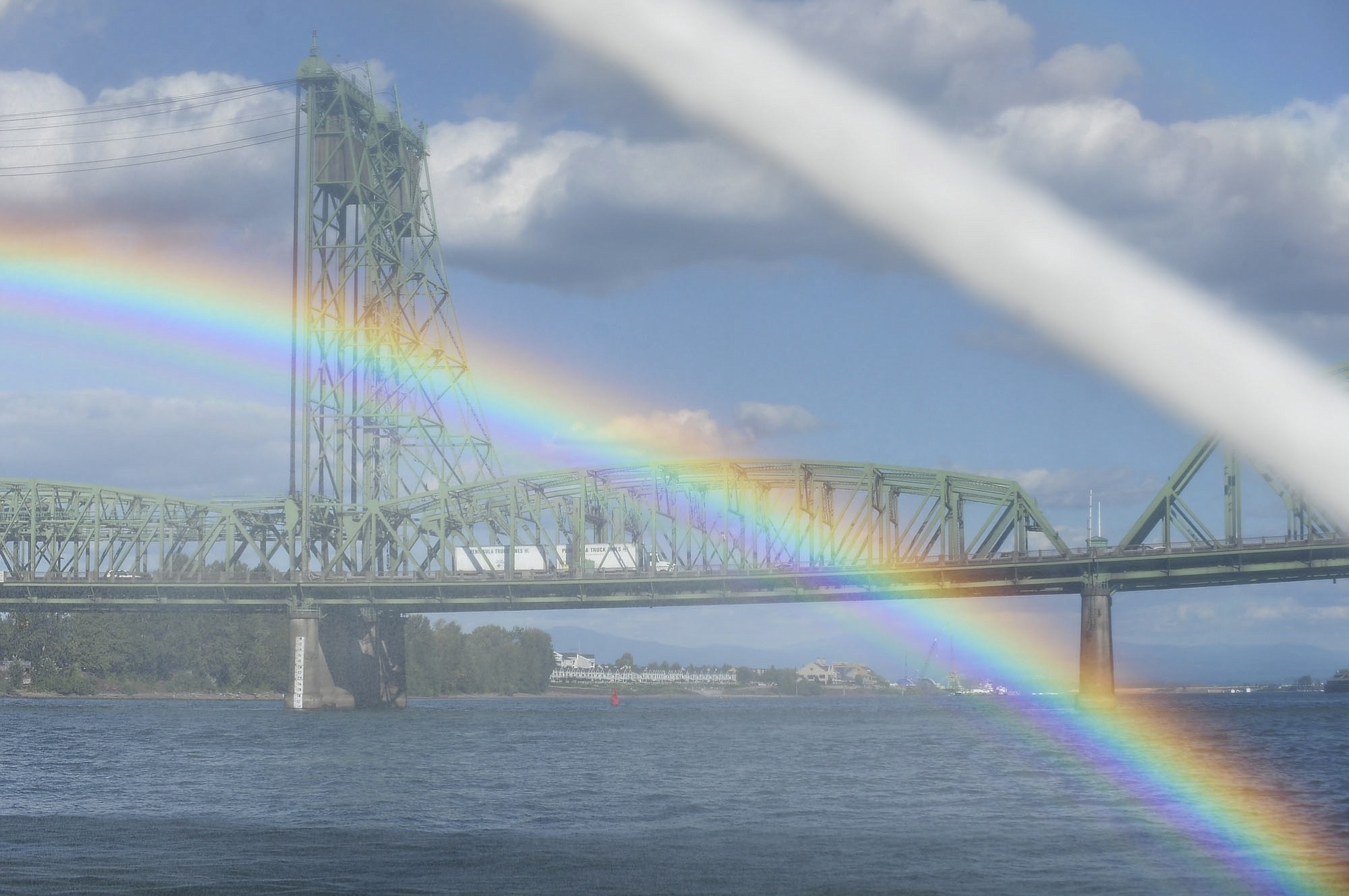 Spray from the Discovery fire boat's water cannons creates rainbows Monday near the Interstate 5 Bridge in Vancouver.