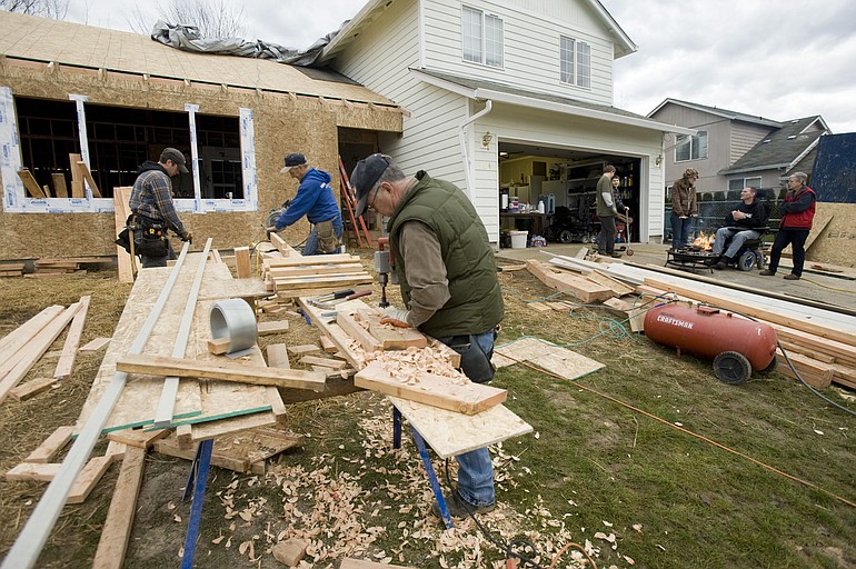 Volunteers work on a home addition for Brian and Jennie Epp recently in Battle Ground.