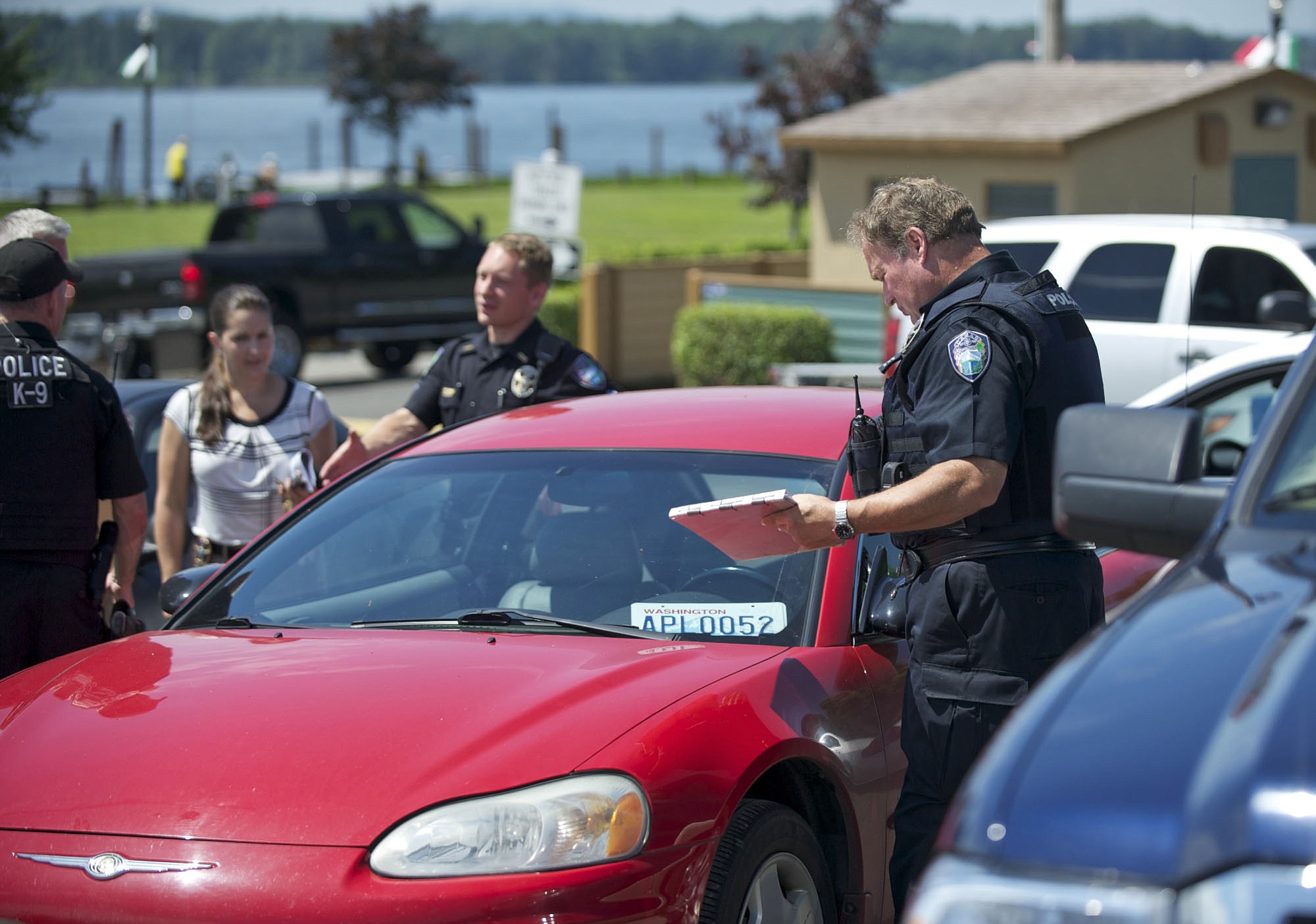 Police at the Port of Camas-Washougal collect evidence Wednesday from a vehicle that was driven by a man who allegedly tried to rob the 7 Market in Camas.